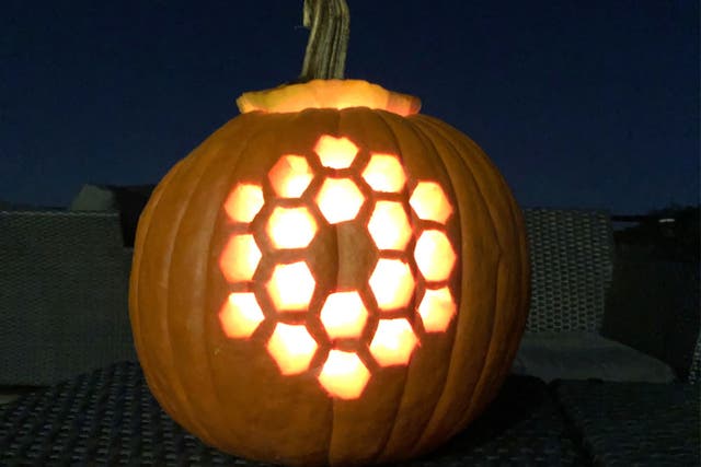 <p>A pumpkin carved in the shape of the iconic, hexagonal primary mirror of the James Webb Space Telescope</p>