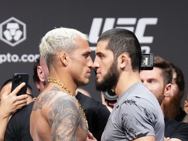 <p>Charles Oliveira (left) and Islam Makhachev face off</p>