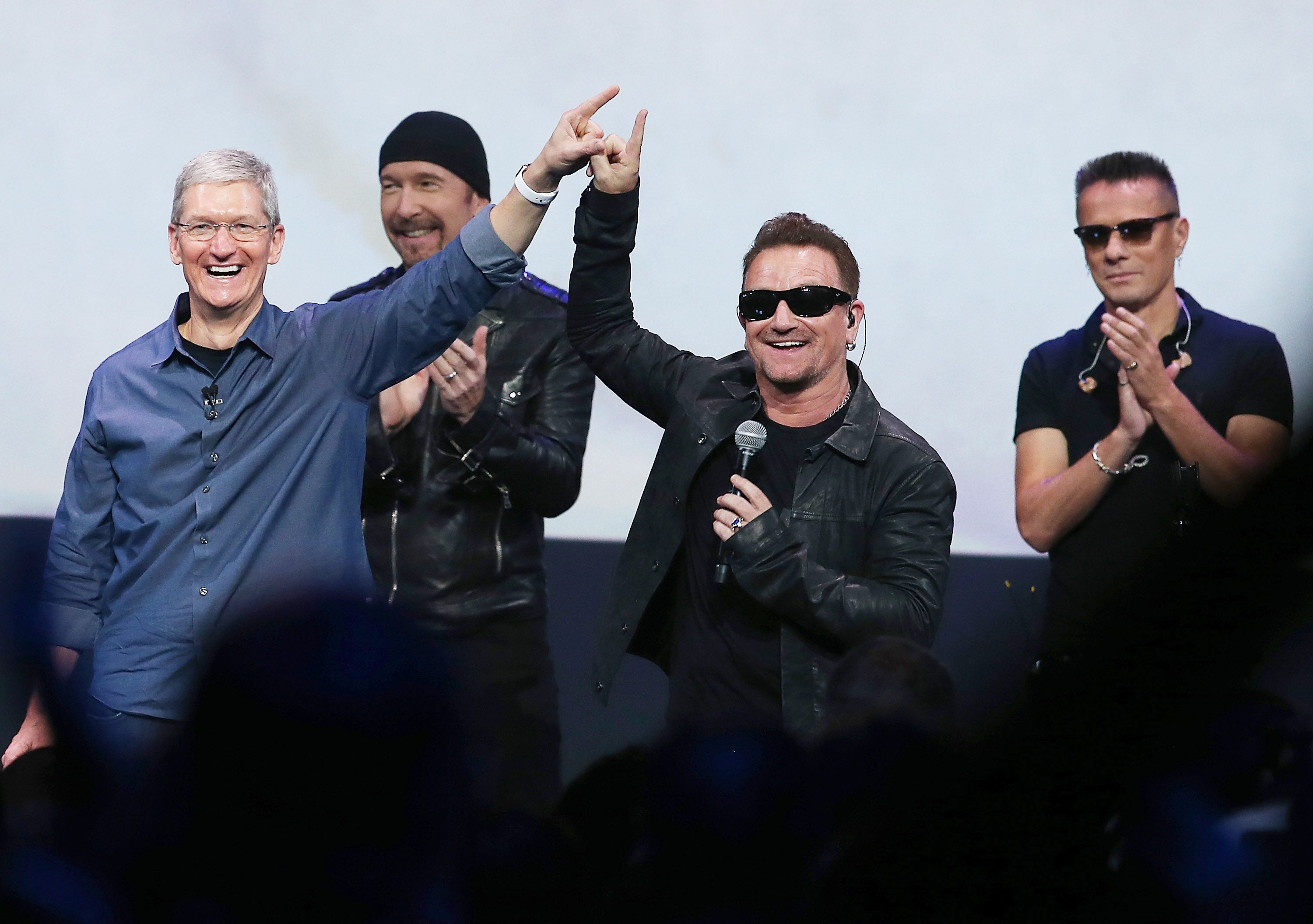U2 with Tim Cook (left)