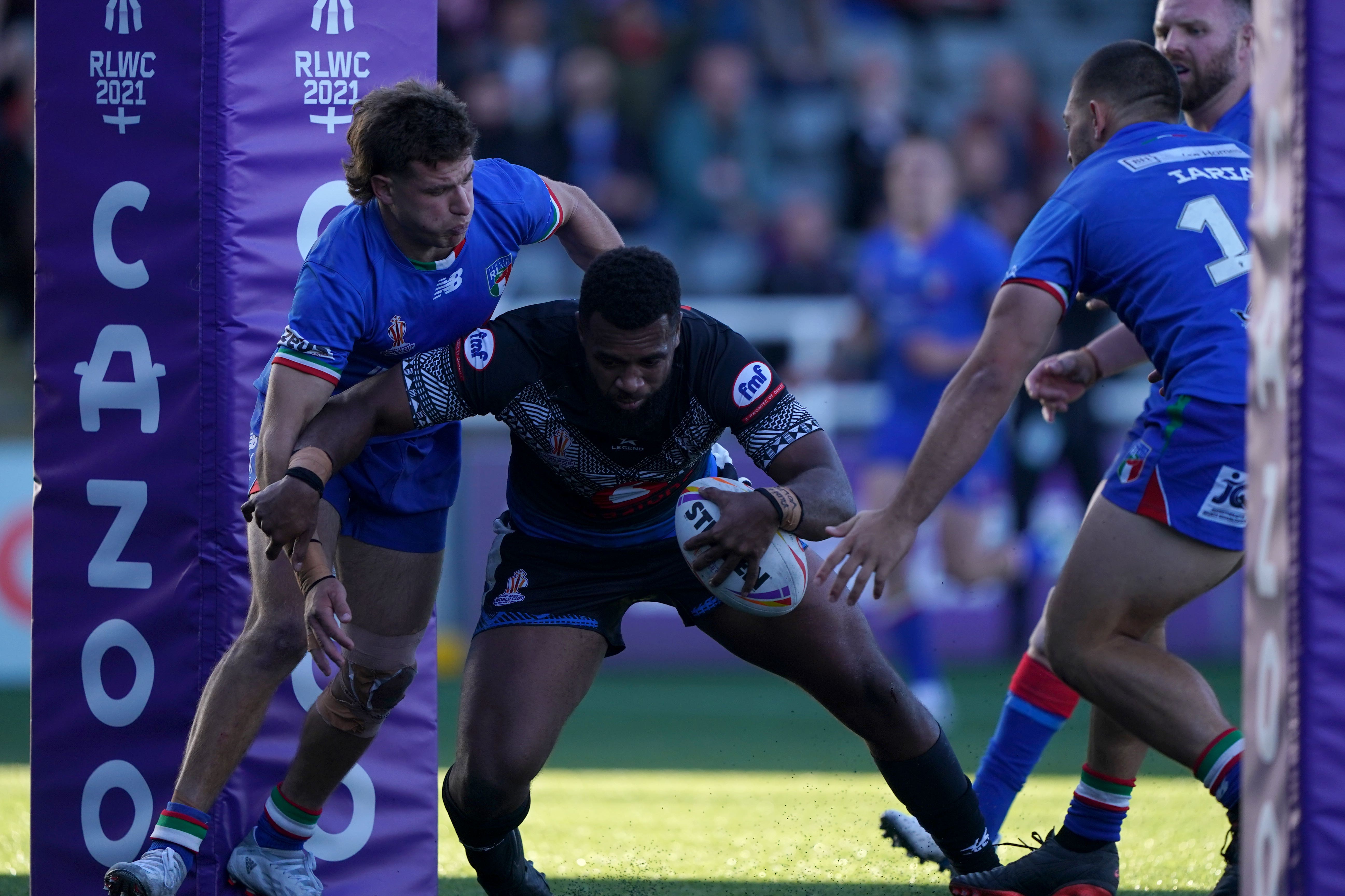 Ben Nakubuwai (centre) scores a try for Fiji (Owen Humphreys/PA)