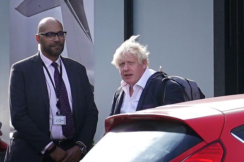 Boris Johnson arrives at Gatwick Airport (PA)