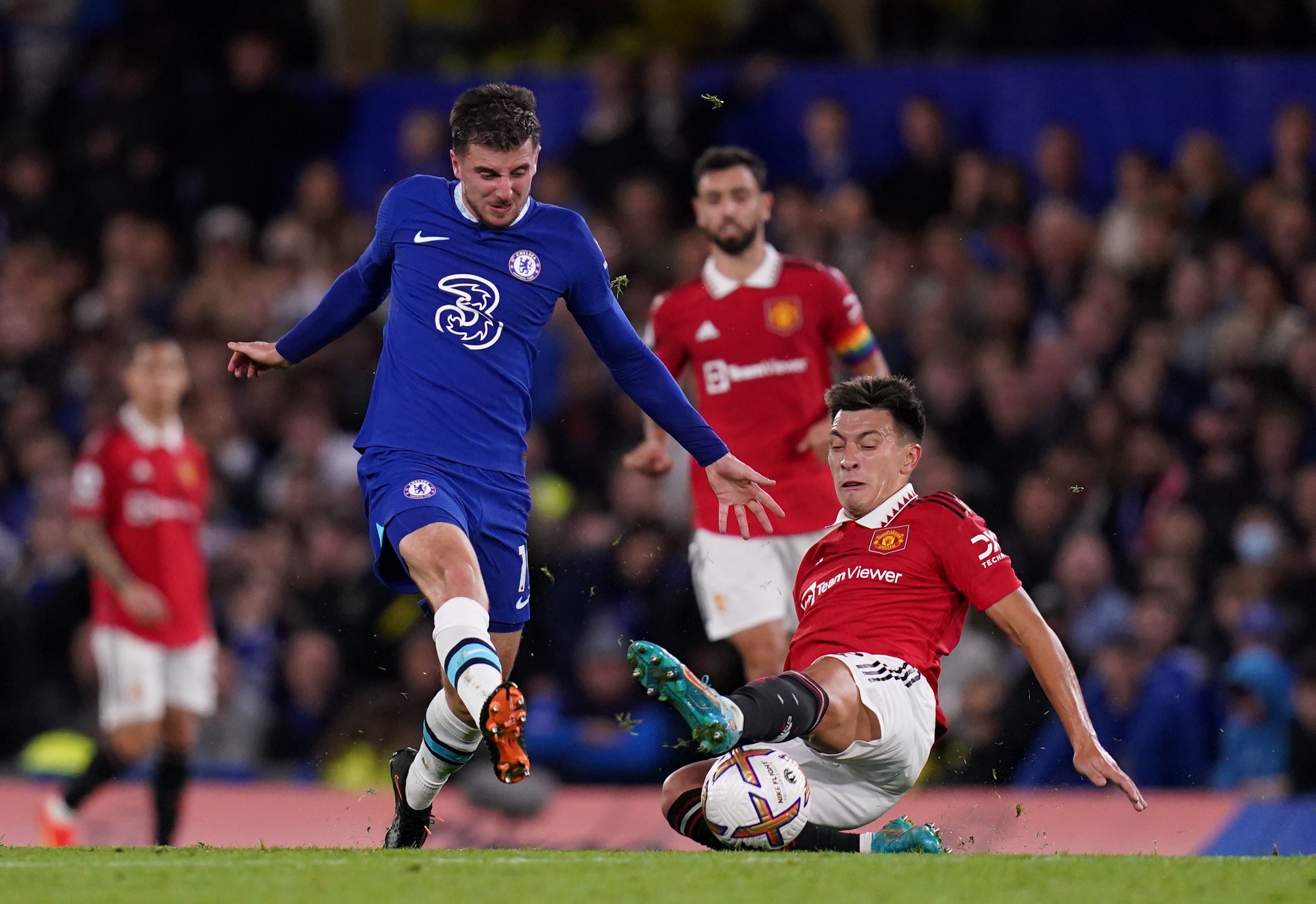 Chelsea's Mason Mount, left, and United's Lisandro Martinez battle for the ball