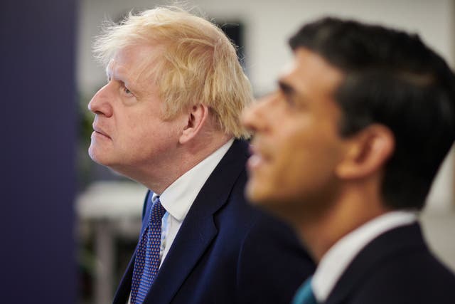 Boris Johnson and Rishi Sunak were said to be locked in talks late into the evening as speculation mounted over whether the pair could strike a deal to lay the foundations for a unified Conservative government (Leon Neal/PA)