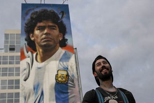 <p>Artist creates 40-metre-high mural of football icon Diego Maradona</p>