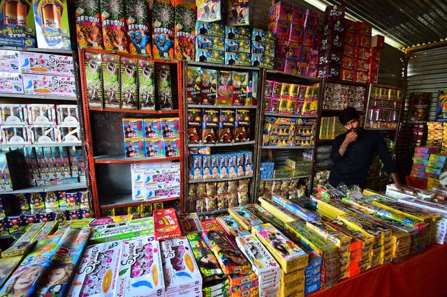 <p>File: A vendor selling firecrackers wait for customers at a market ahead of the Hindu festival of Diwali, in Allahabad</p>