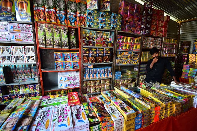 <p>File: A vendor selling firecrackers wait for customers at a market ahead of the Hindu festival of Diwali, in Allahabad</p>