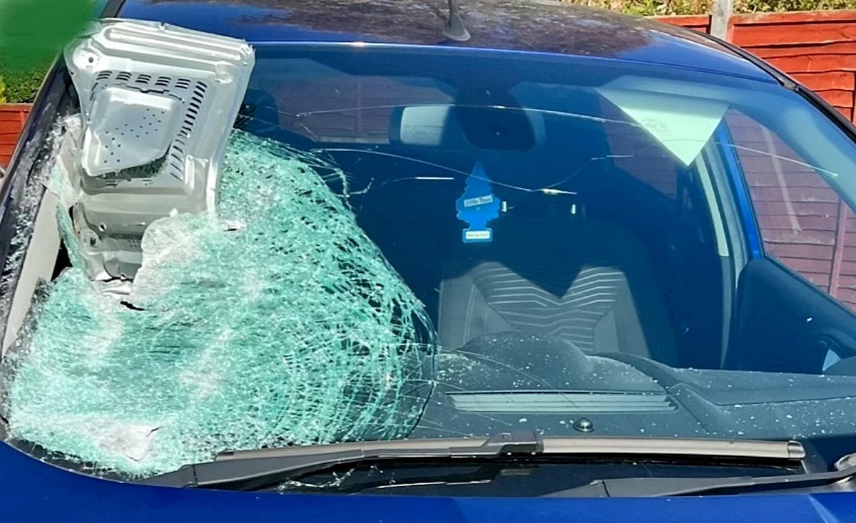 Two arrested after a microwave thrown through windscreen of moving car Two arrested after a microwave thrown through windscreen of moving car