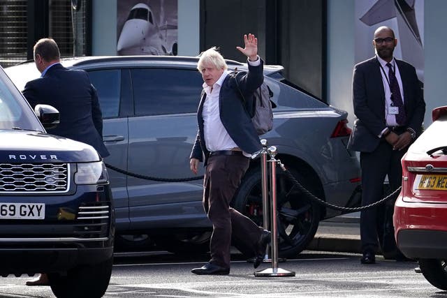 Boris Johnson arrives back at Gatwick Airport from his Caribbean holiday (Gareth Fuller/PA)