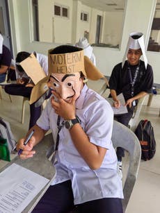 Students in Philippines wear creative ‘anti-cheating’ hats after professor gives them permission ‘to go wild’