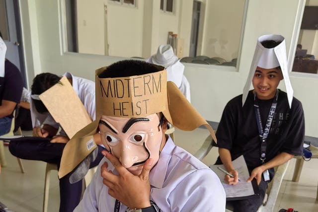 <p>‘Anti-cheating’ masks, hats and helmets worn by Filipino students. Photo shared by Mandane-Ortiz R Mary Joy</p>