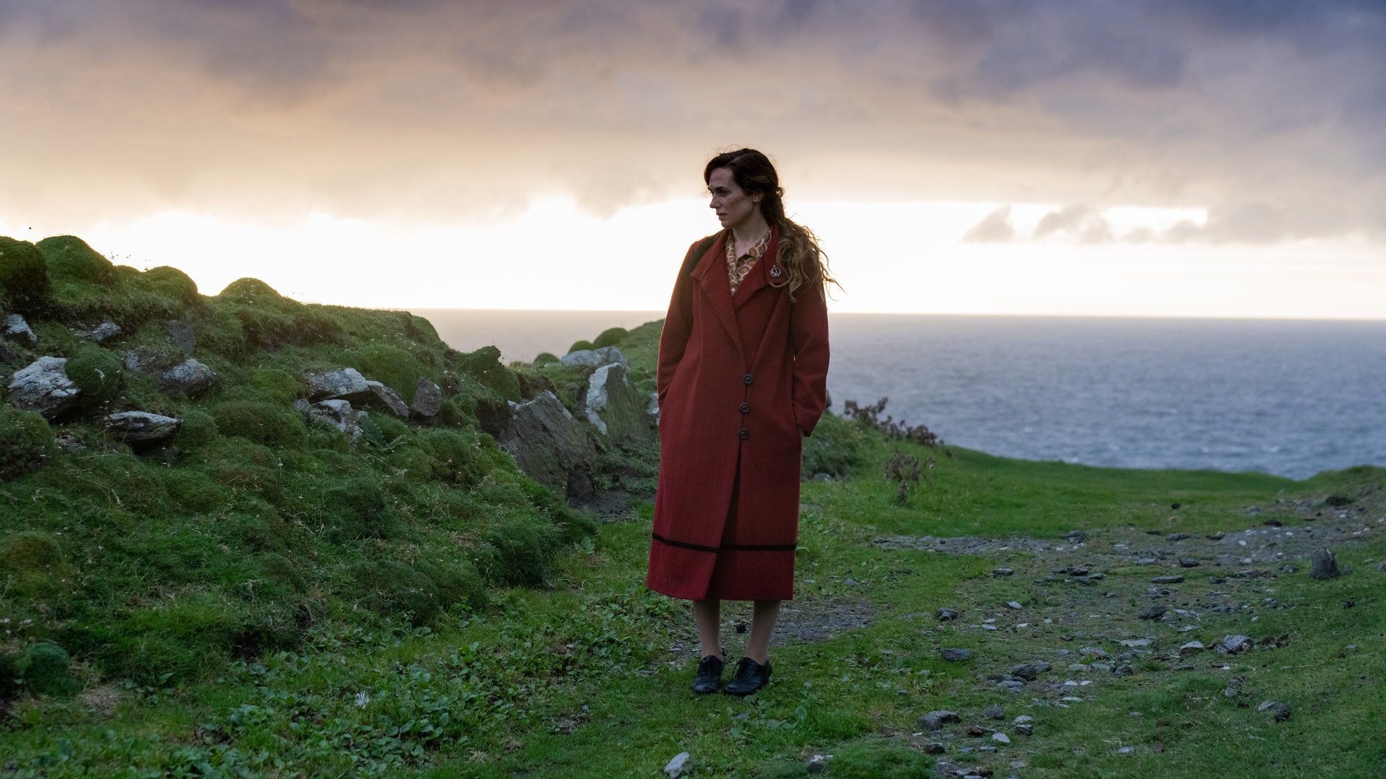 Actress Kerry Condon on a clifftop in the film