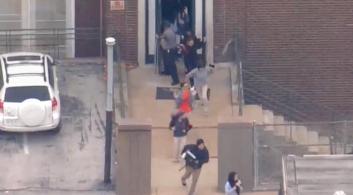 Disturbing videos show police helping terrorised students escape shooting at St Louis high school