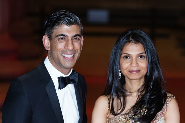 Rishi Sunak alongside his wife Akshata Murty (Ian West/PA)