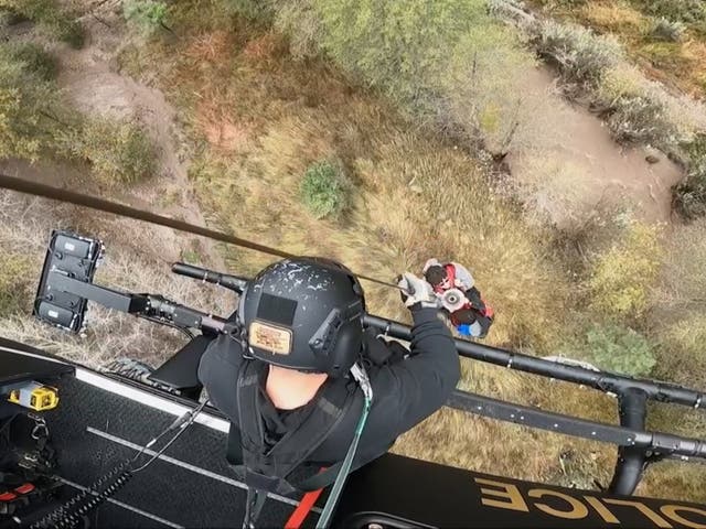 <p>Stranded campers are hoisted to safety near the Gila Cliff Dwellings National Monument on 8 October 2022</p>