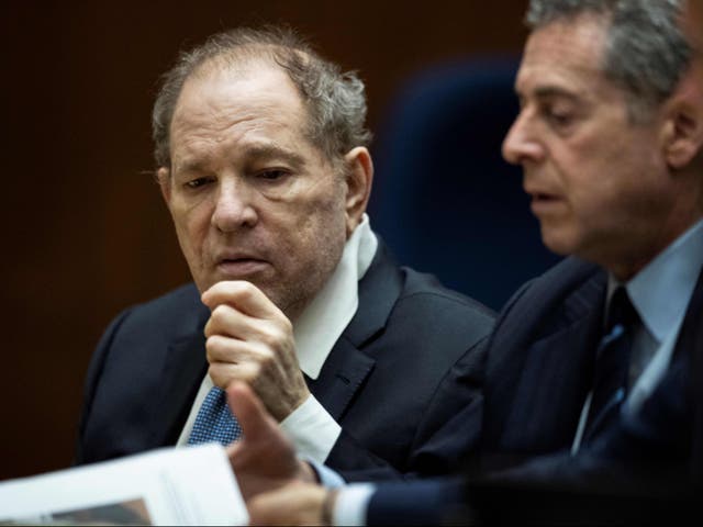 <p>Harvey Weinstein interacts with his attorney in court on 4 October 2022 in Los Angeles, California</p>
