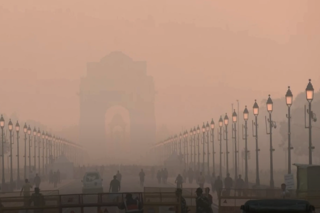 <p>A view of India Gate covered in smog in the heart of New Delhi after a day of Diwali celebrations. The AQI plummeted to its lowest this season on Tuesday morning</p>