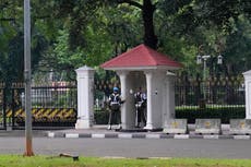 Indonesian woman arrested after pointing gun at palace guard