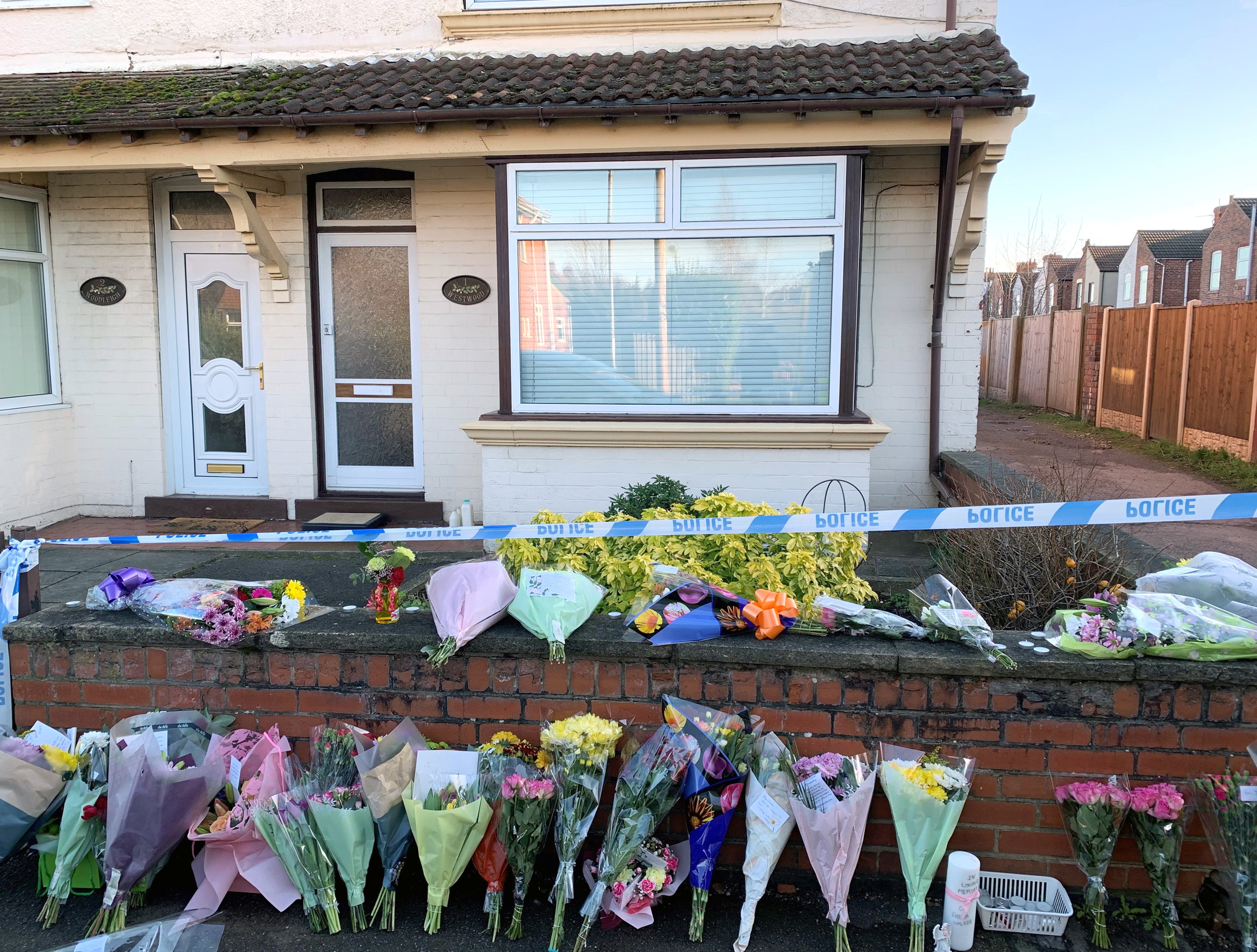 Flowers outside a house on Station Road, Langwith Junction, Shirebrook, near Bolsover, where Freda Walker was killed