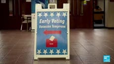 Polling stations ramp up security as early voting begins in US midterm elections