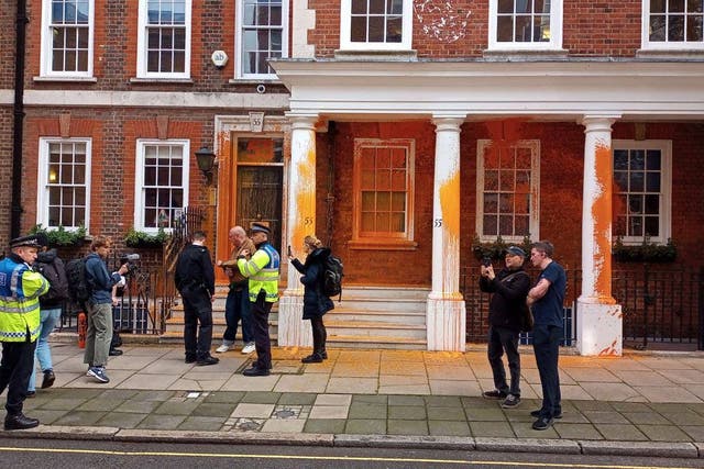 Just Stop Oil protesters sprayed orange paint onto the facade of 55 Tufton Street in Westminster (PA)