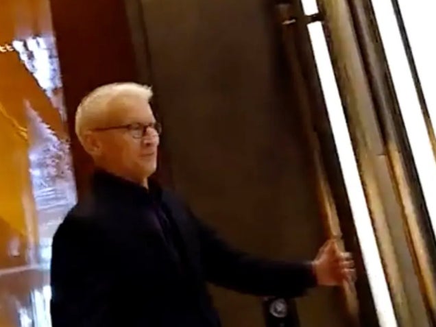 CNN primetime anchor Anderson Cooper enters a secured section of the CNN headquarters in New York after a heckler followed him through the building