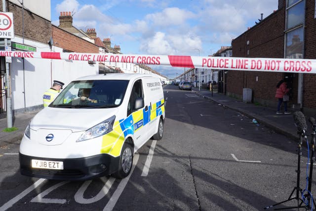 A police forensic van near to the scene in Ilford after two men died and a third was left critically injured after a shooting (Ian West/PA)