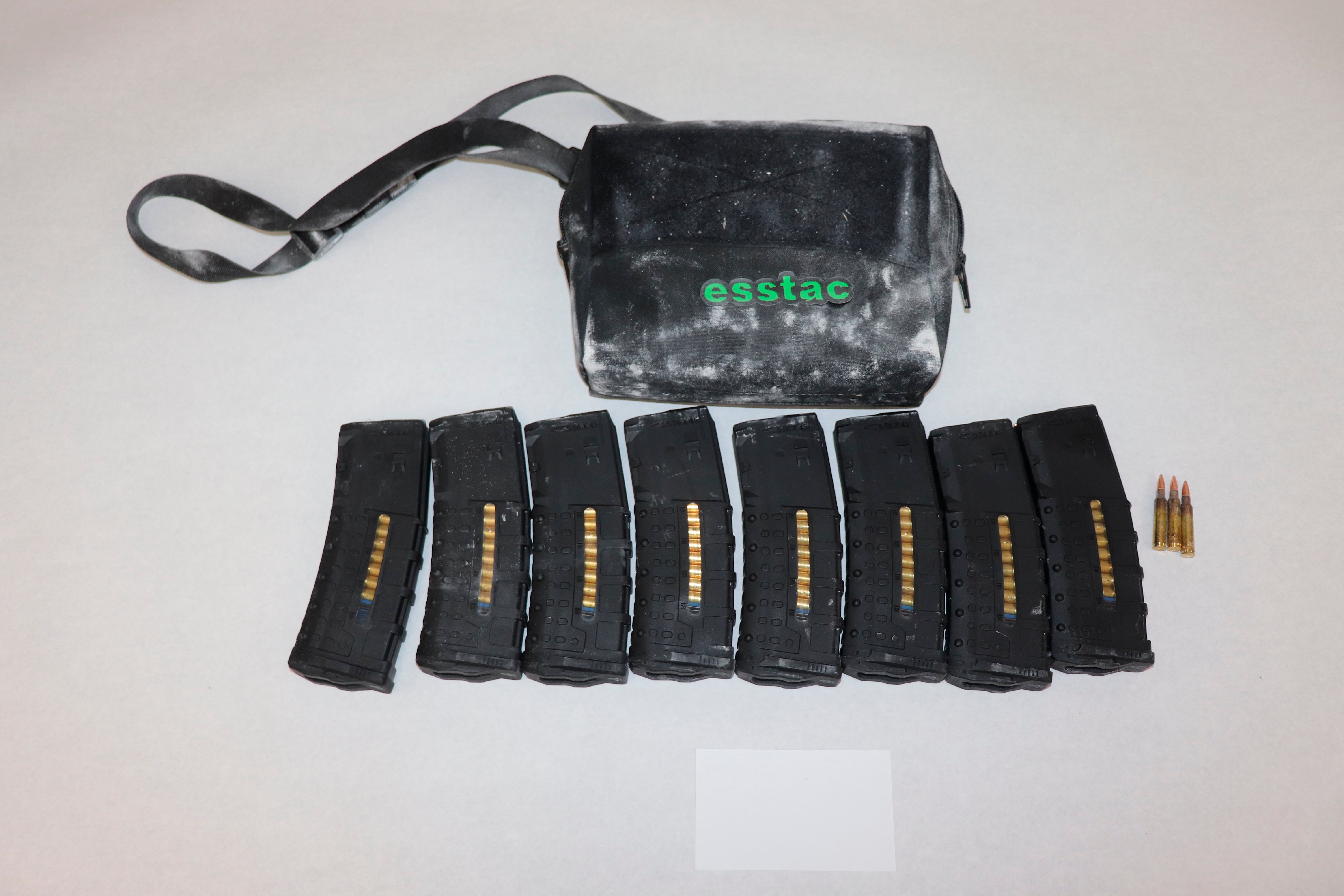 This image provided by the St. Louis Metropolitan Police Department shows ammunition and magazines used by a 19-year-old gunman who killed a teacher and a 15-year-old girl at a St. Louis high school on Monday, Oct. 24, 2022