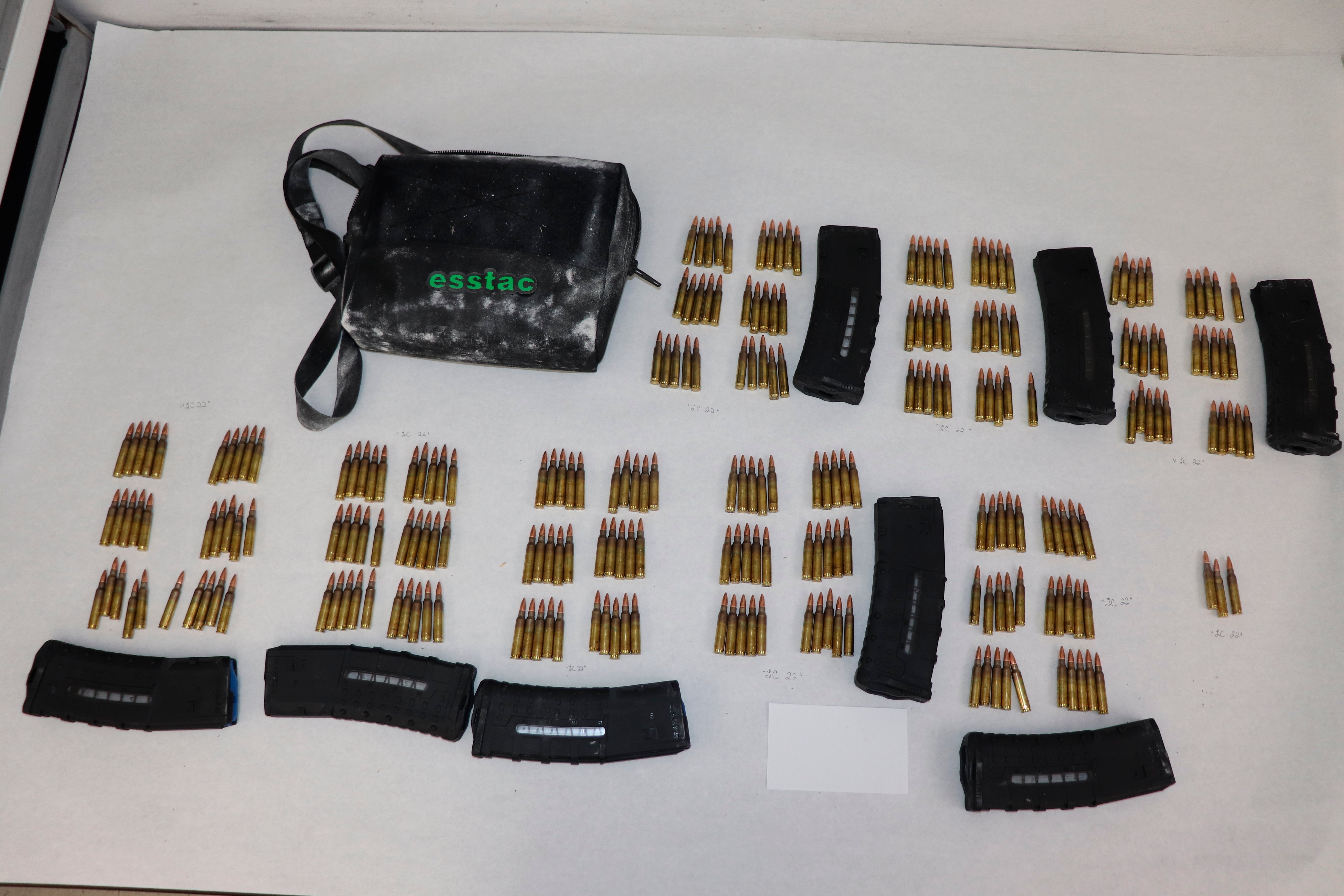 This image provided by the St. Louis Metropolitan Police Department shows ammunition and magazines used by a 19-year-old gunman who killed a teacher and a 15-year-old girl at a St. Louis high school on Monday, Oct. 24, 2022