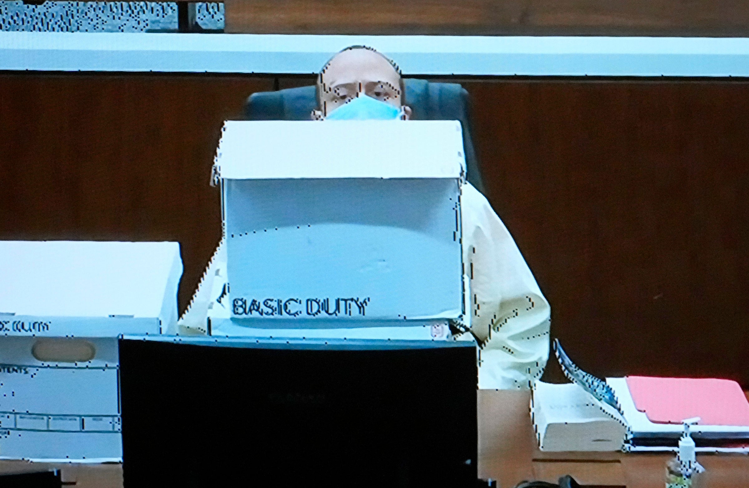 Darrell Brooks makes a fort with boxes during his murder trial