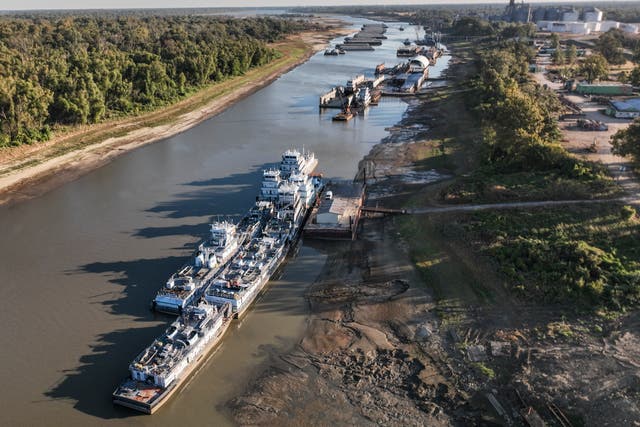 <p>Barges along the Mississippi River in Greenville, Mississippi on Saturday</p>