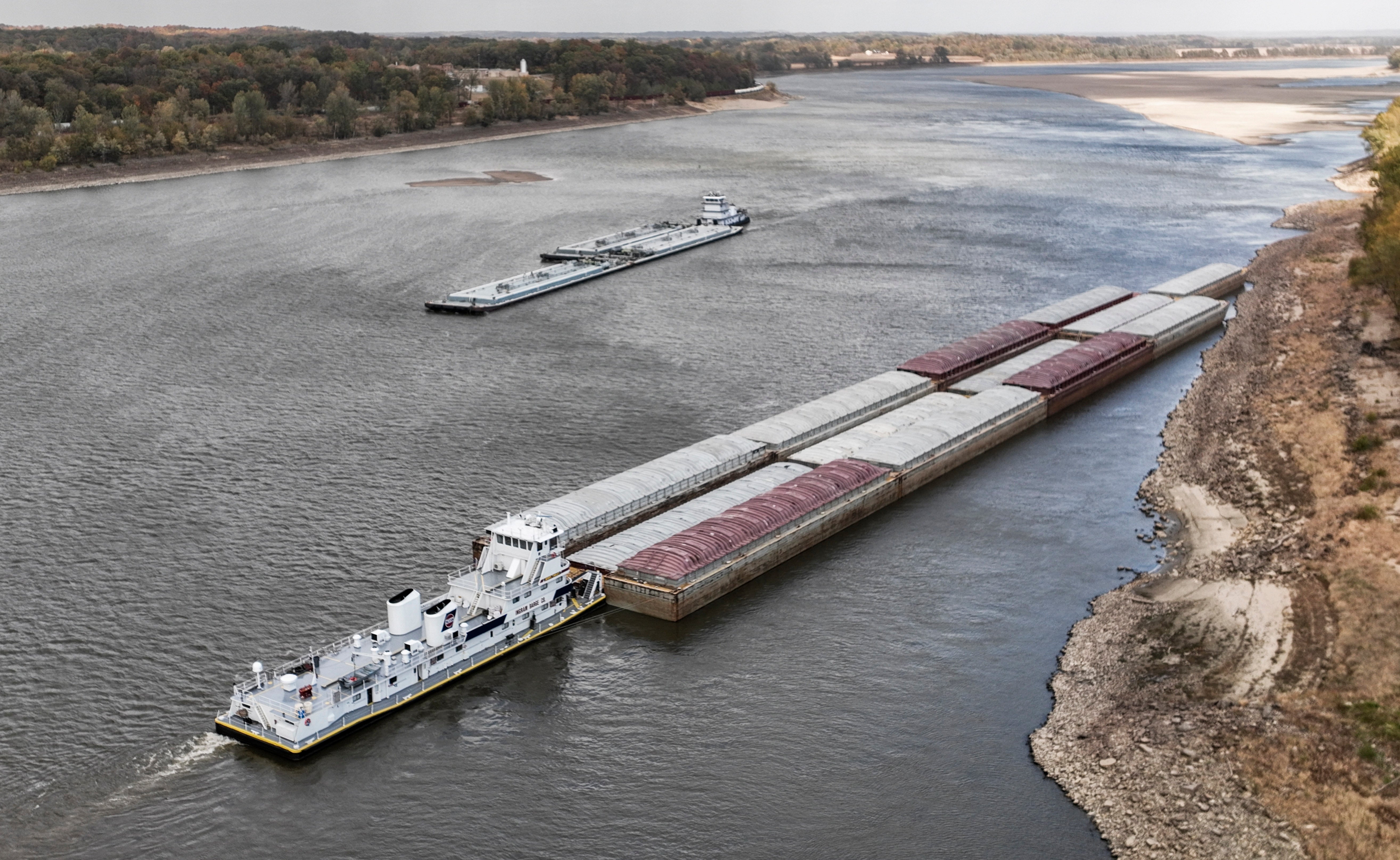 A boat waits for another to pass in a narrow stretch of the Mississippi River in Missouri on Sunday