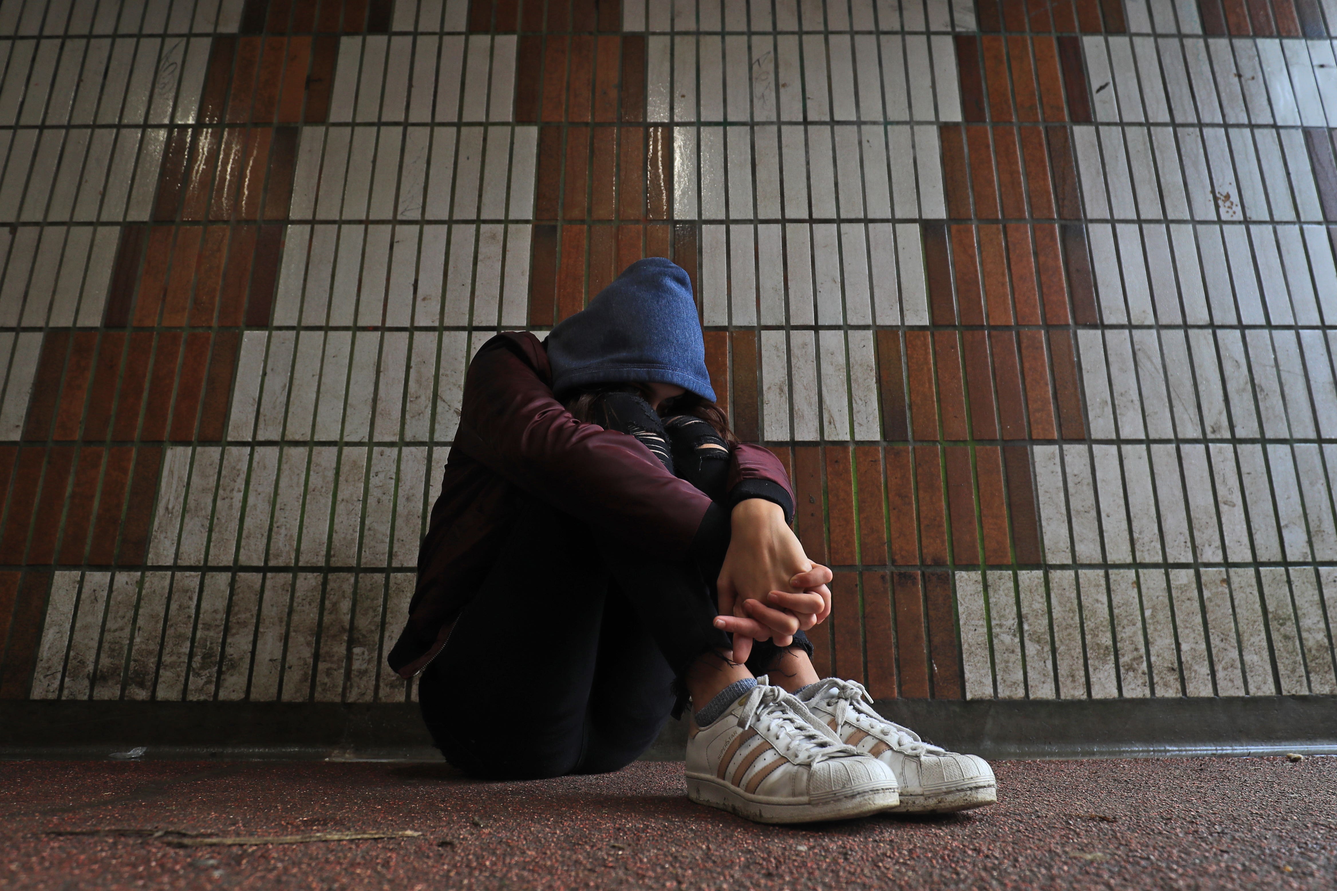 Picture posed by a model of a teenage girl showing signs of mental health issues (Gareth Fuller/PA)