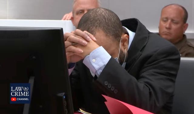 <p>Darrell Brooks rests his head in his hands as he is convicted on all charges </p>