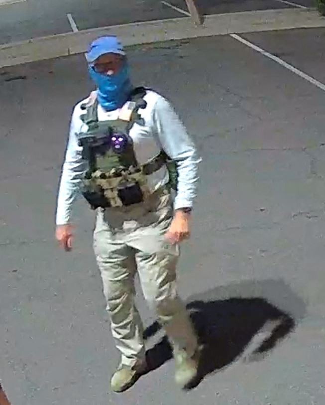 An individual in tactical gear was pictured near a ballot drop box in Mesa, Arizona on 21 October.