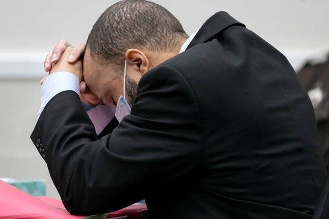 <p>Darrell Brooks puts his head in his hands as the verdict is read out </p>