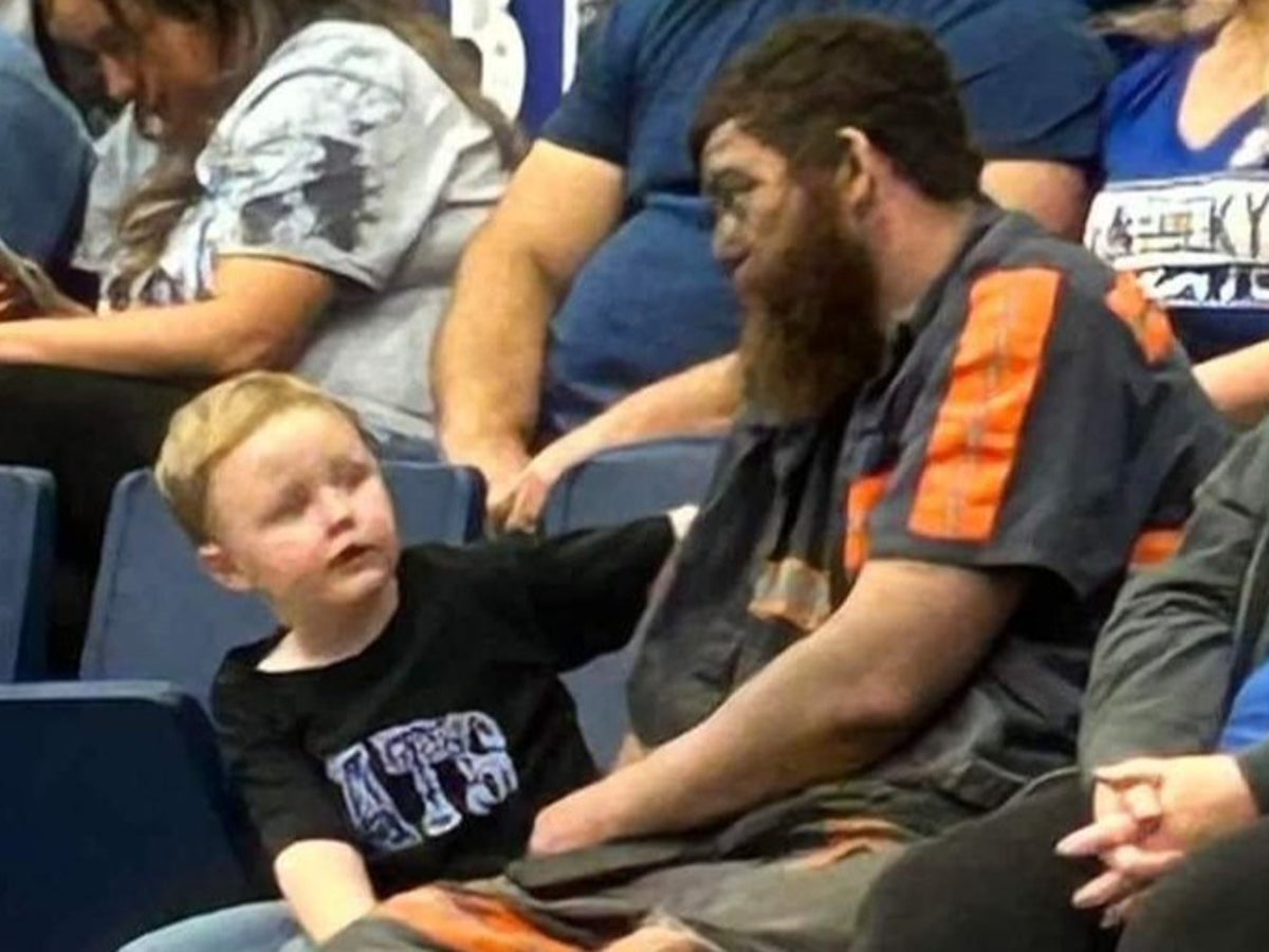 Soot-covered coal miner goes viral for taking family to basketball game straight after shift
