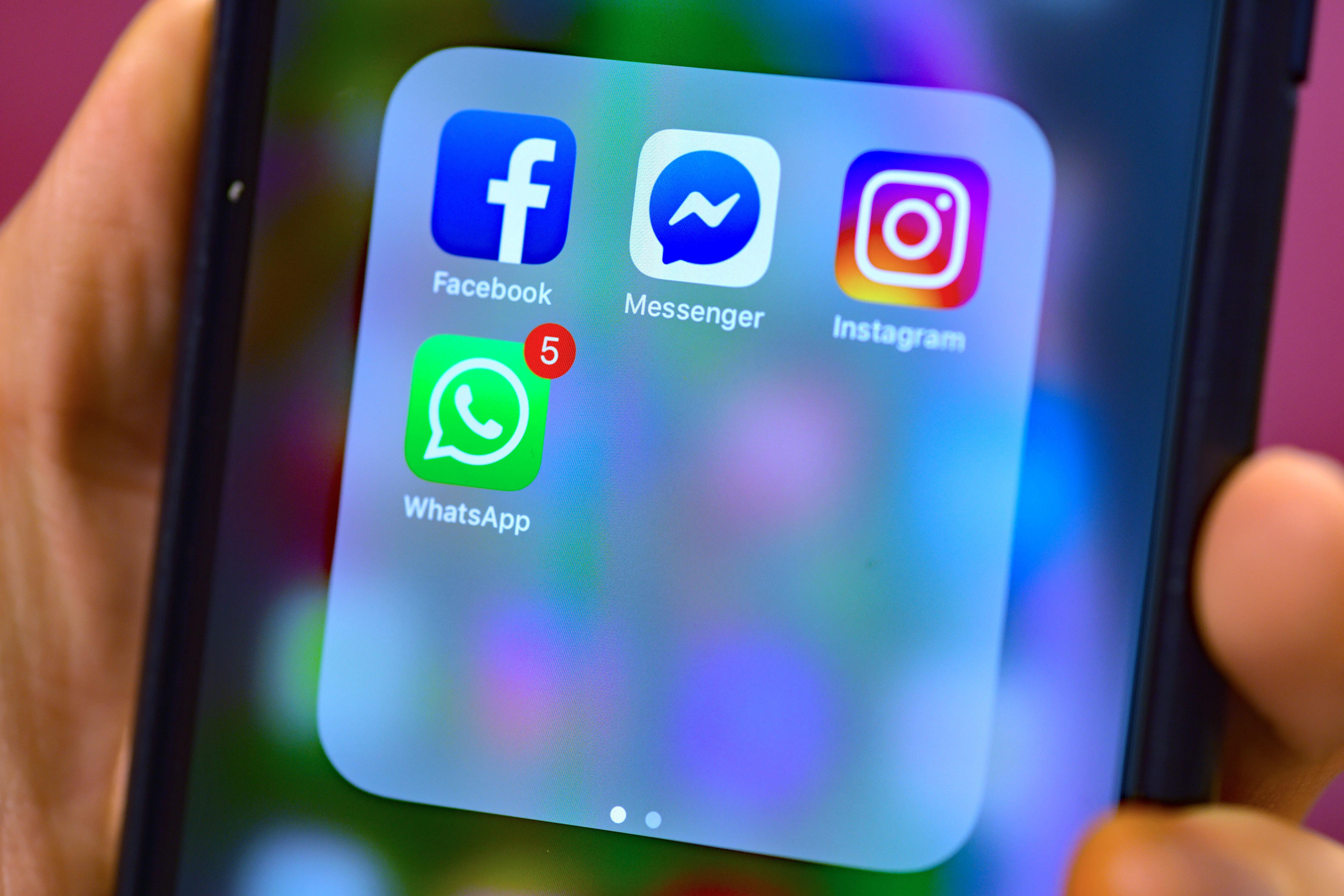 Stock photo of Facebook, Messenger, Instagram and WhatsApp, social media app icons on a smart phone.