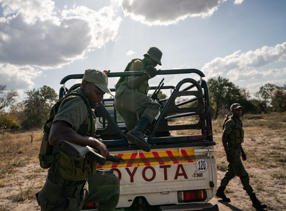 <p>An anti-poaching unit armed with AK-47 semiautomatic weapons</p>