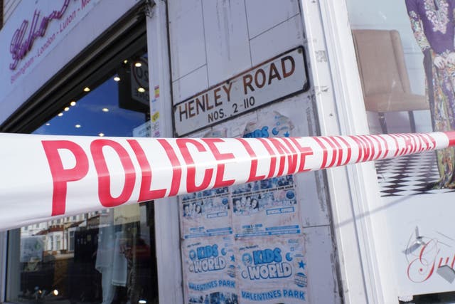 Police tape at the scene in Ilford after two men died and a third was left critically injured (Ian West/PA)