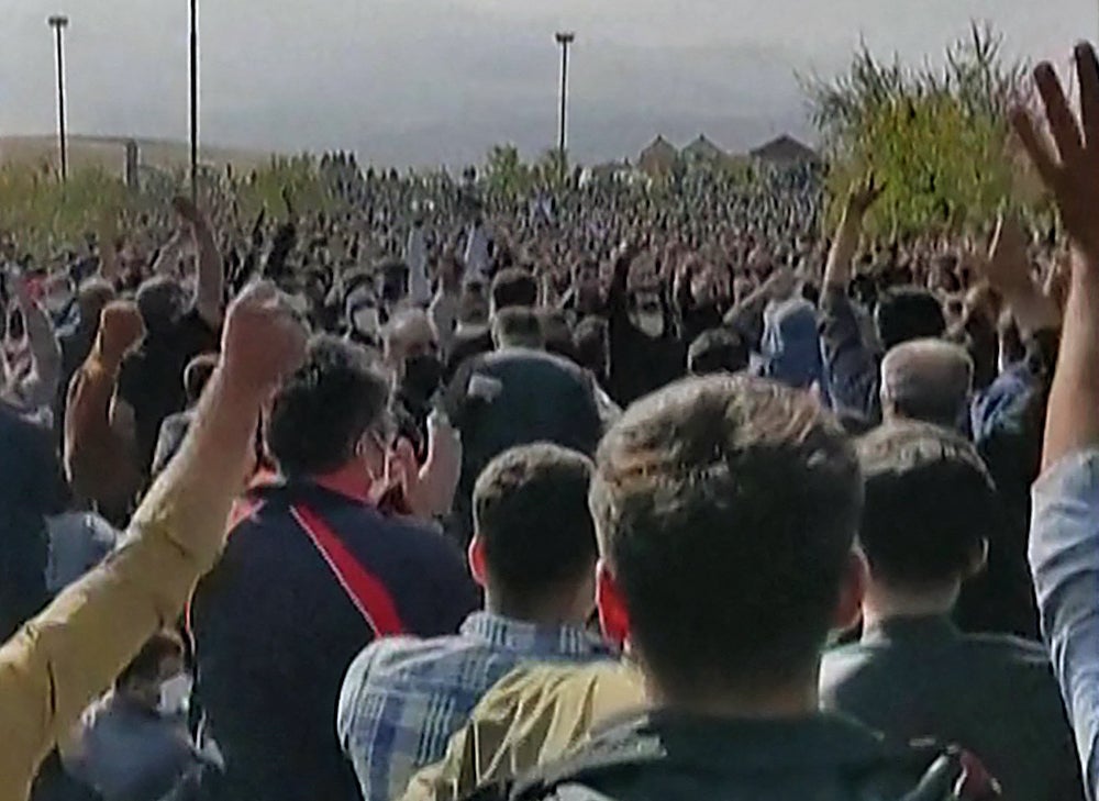 Hundreds of protesters clap and cheer during a rally in Saqqez, Mahsa Amini’s hometown