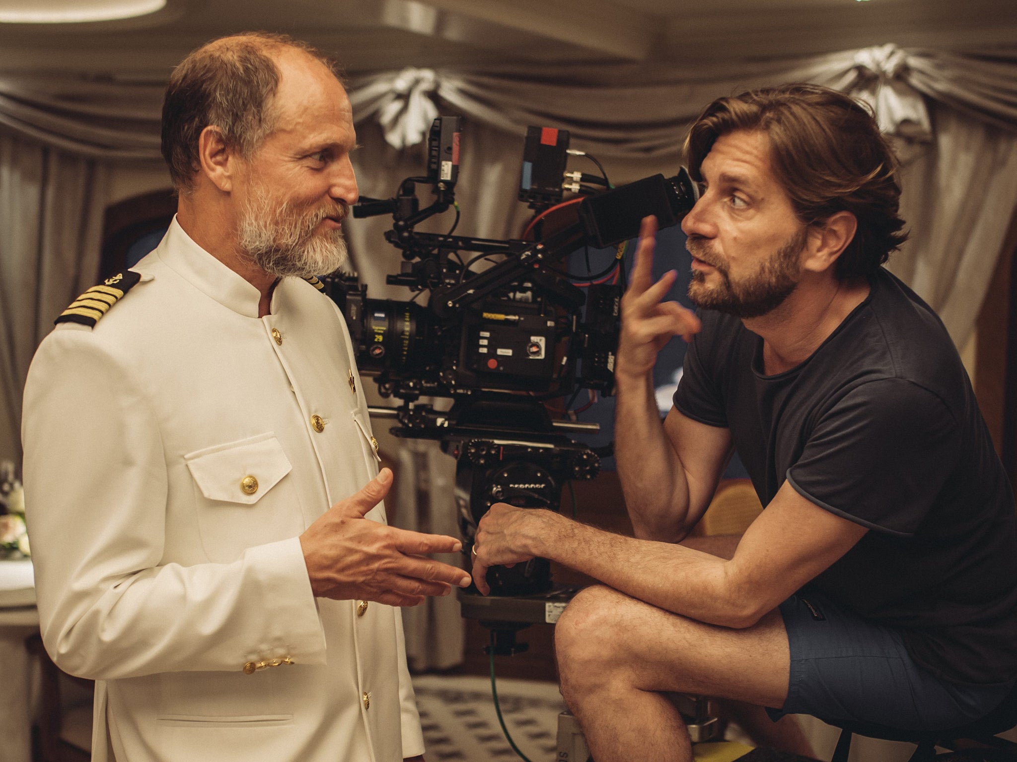<p>Woody Harrelson and filmmaker Ruben Östlund on the set of ‘Triangle of Sadness’ </p>