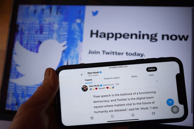 File photo dated 26/04/22 of the Twitter social media app displaying a tweet by Elon Musk on a mobile phone in London, as Elon Musk has said his deal to buy Twitter is “temporarily on hold” over details around the number of spam and fake accounts present on the site.