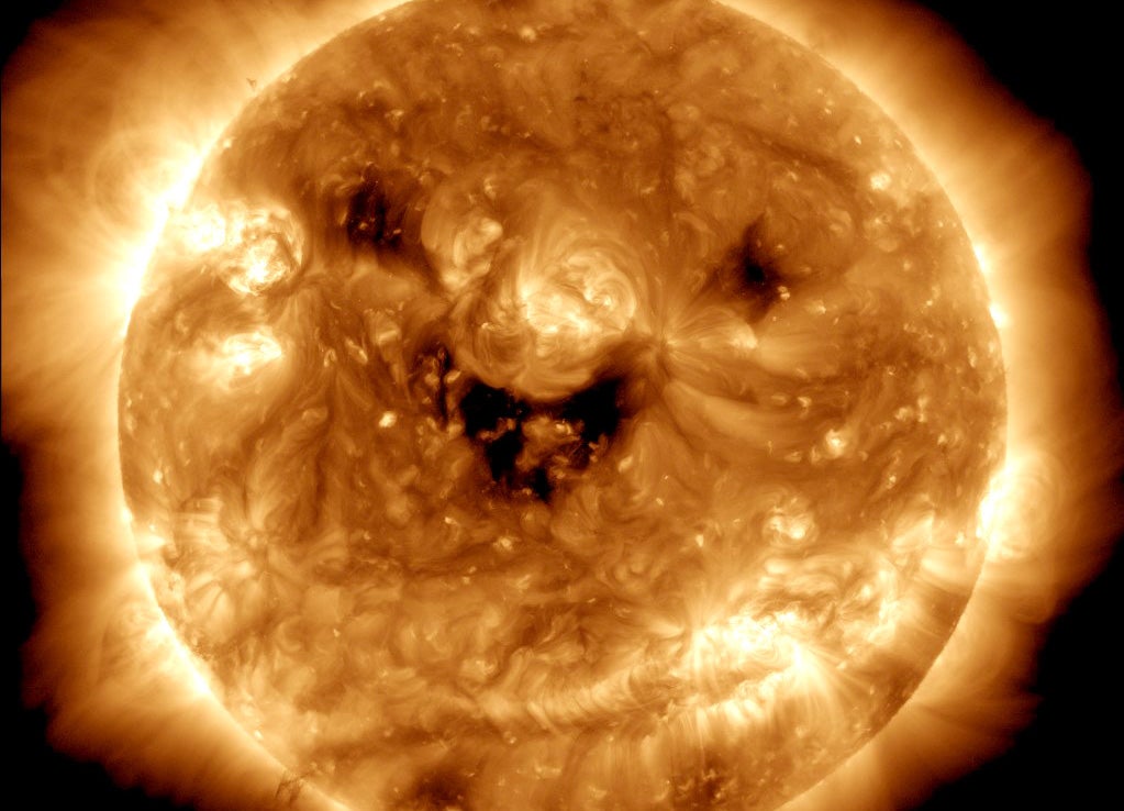 Sun appears to smile in Nasa picture