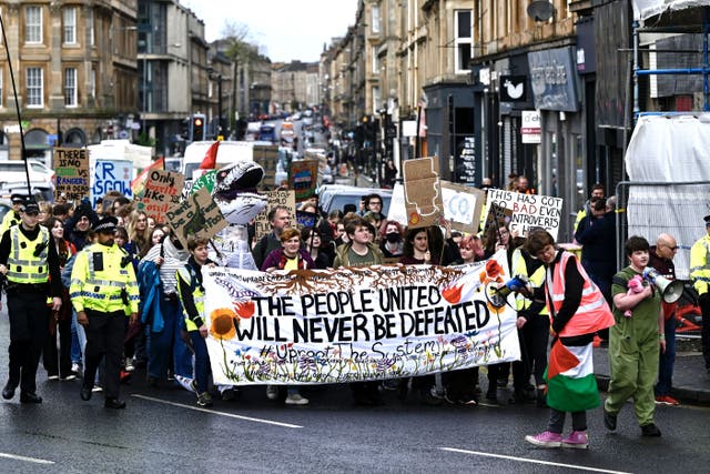 Demonstrators took part in the Fridays for Future Scotland march through Glasgow on Friday (John Linton/PA)