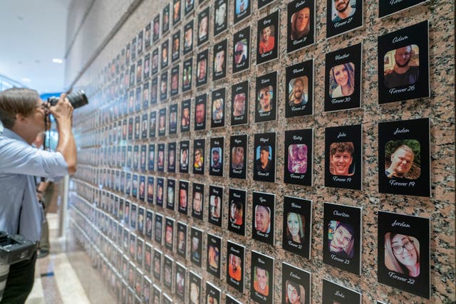 <p>A photojournalist takes pictures of the exhibits on “The Faces of Fentanyl” at DEA headquarters. </p>