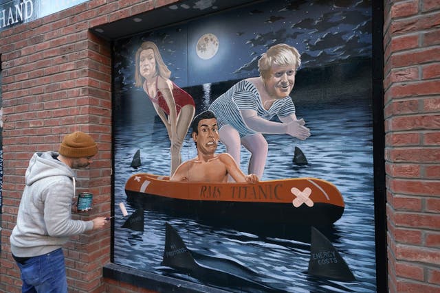 A mural depicting Rishi Sunak aboard a dinghy named RMS Titanic (Brian Lawless/PA)
