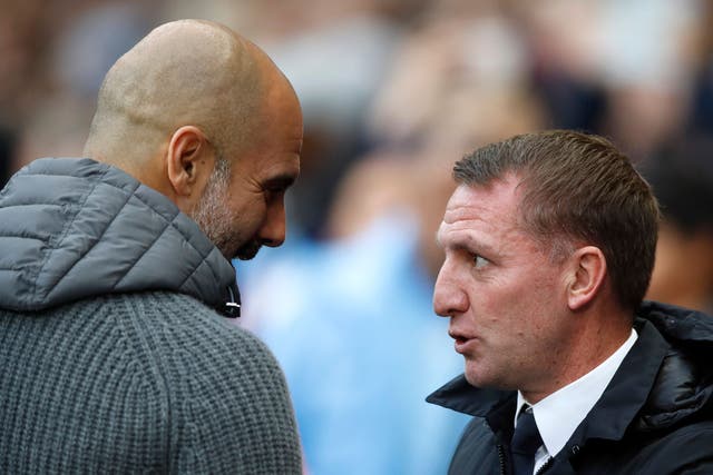 Pep Guardiola’s Manchester City take on Brendan Rodgers’ Leicester (Martin Rickett/PA)