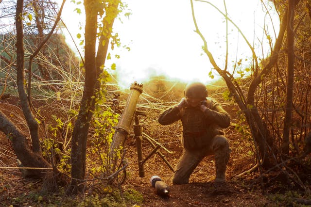 <p>A Ukrainian serviceman fires with a mortar toward Russian positions on Friday</p>