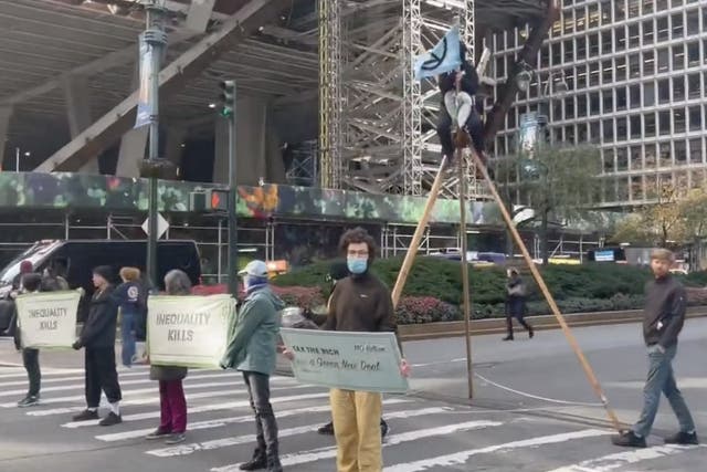<p>Climate protestors block traffic on Park Avenue in New York on Friday</p>