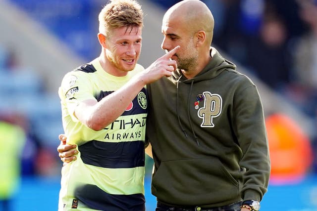 Pep Guardiola celebrates Manchester City’s 1-0 win at Leicester with matchwinner Kevin De Bruyne (David Davies/PA Images).